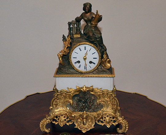 Lot 266: 19th c gilt bronze and spelter mantle clock with statue of lady with harp. H38 x W26cm.