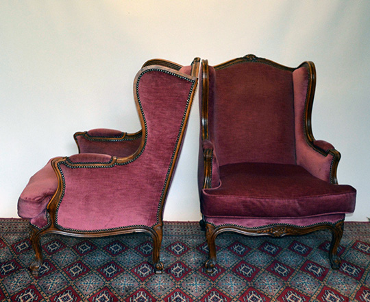 Lot 270_1: Large pair Louis XV style red velvet covered bergeres with 'ears' wing sides.