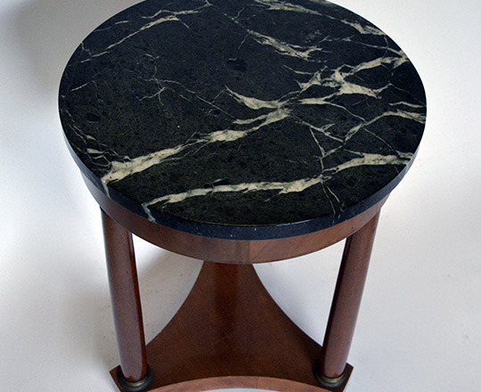 Lot 278_1: Empire style dark green veined marble top on a three column base H71 x dia.50cm.