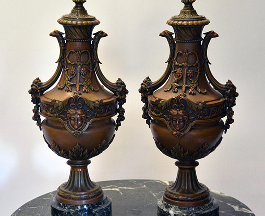 Lot 279: Large pair bronze wash spelter lidded vases on a green marble base. H45cm.