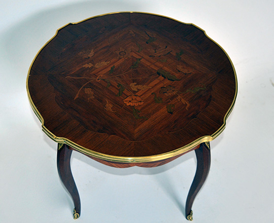 Lot 281_1:  Round Louis XV low center table with floral marquetry top and brass skirt. H50 x dia.61cm.