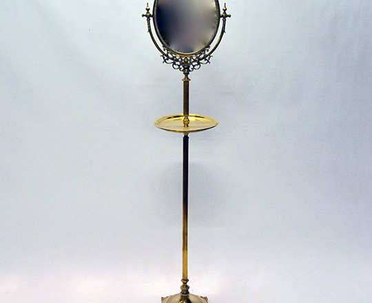 Lot 286: Turn cent? Gilt bronze/brass barber stand with tilt oval mirror. H 159cm.
