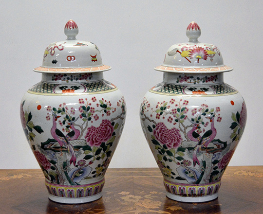 Lot 388: Pair early?cent lidded Chinese Rose family vases with floral and animal scenes. H37cm. (knob rep.)
