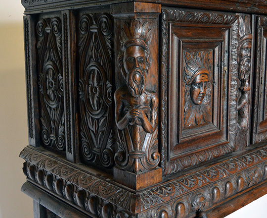 Lot 405_2: 17th cent well restored two stage oak cabinet on a console base with finely carved faces on top section. H139xW101xD57cm.