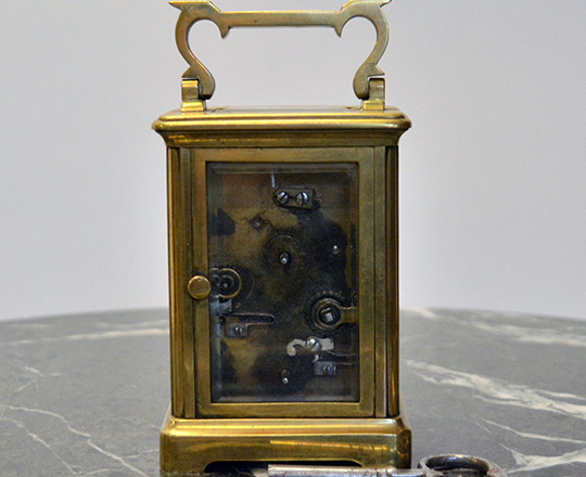 Lot 422_1: 19th cent bronze travel clock with alarm setting. H14,4xW8xD6,5cm.