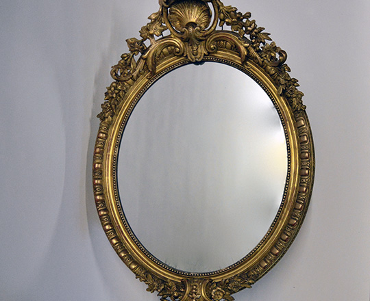 Lot 434: 19tn cent. Louis XV gilt oval mirror with rich ornated pediment (rep.) H100 x W69cm.
