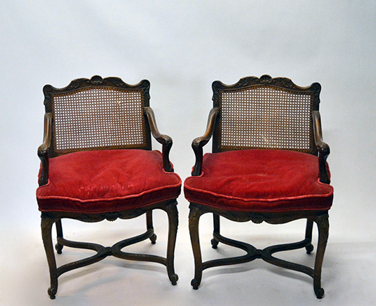 Lot 435: Pair 18th ? 19th cent caned Louis XV / Regence walnut armchairs with stretcher base.