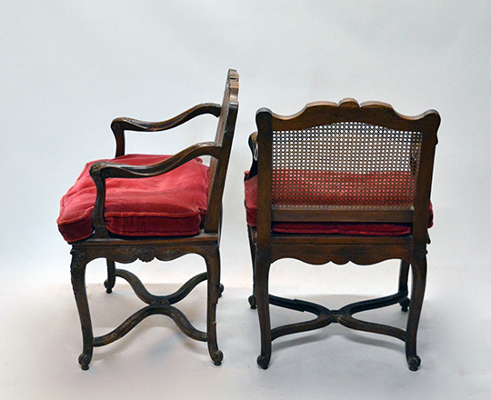 Lot 435_1: Pair 18th ? 19th cent caned Louis XV / Regence walnut armchairs with stretcher base.