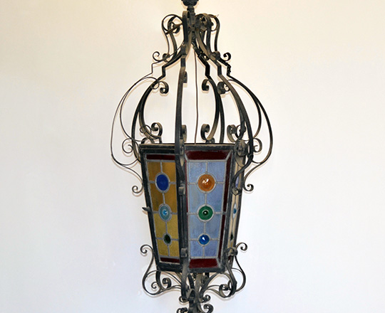 Lot 452: Large 19th cent. Iron lantern with colored stained glass. H100cm