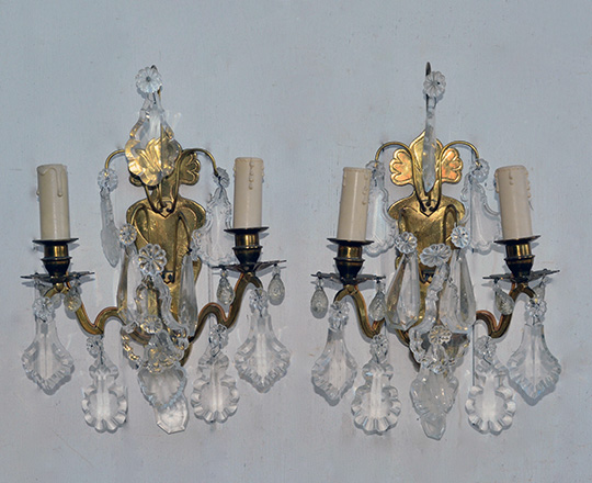 Lot 488: Pair early cent gilt brass, crystal two light wall sconces. H 36cm.