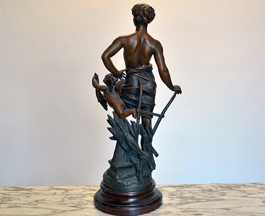 Lot 497_1: Turn cent bronze wash spelter statue of man representing 'Agriculture'. H62cm