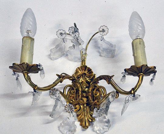 Lot 519_1: Pair gilt bronze two light crystal wall sconces. H25 x W30cm.