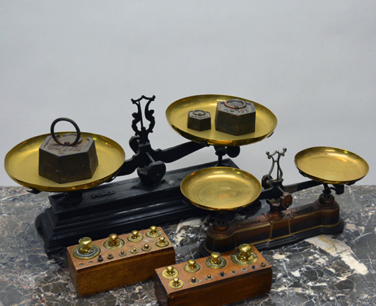Lot 530: Two 19th cent scales withtwo sets of bronze weights in original casing plus three cast iron.
