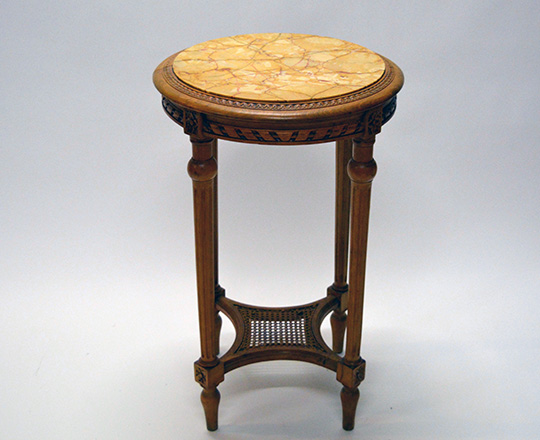 Lot 545: Louis XVI style marble top round center table with caned stretcher. H 72 x dia.45cm.