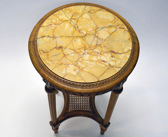 Lot 545_1: Louis XVI style marble top round center table with caned stretcher. H 72 x dia.45cm.